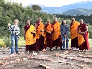 Anita and Tibetan Buddhist monks who came to bless Owl Farm - and Owl Farm neighbor named Destiny